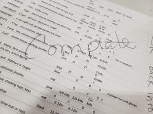 A printout of childrens wishes with a handwritten "complete" across the page. 